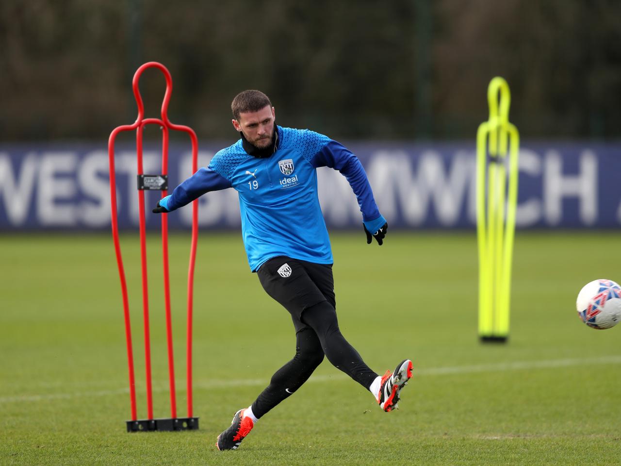 John Swift striking a ball in training