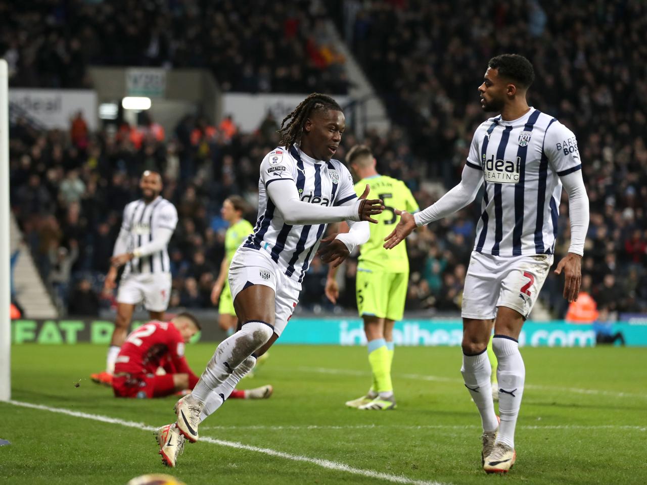 Brandon Thomas-Asante celebrates scoring his second against Blackburn with Darnell Furlong