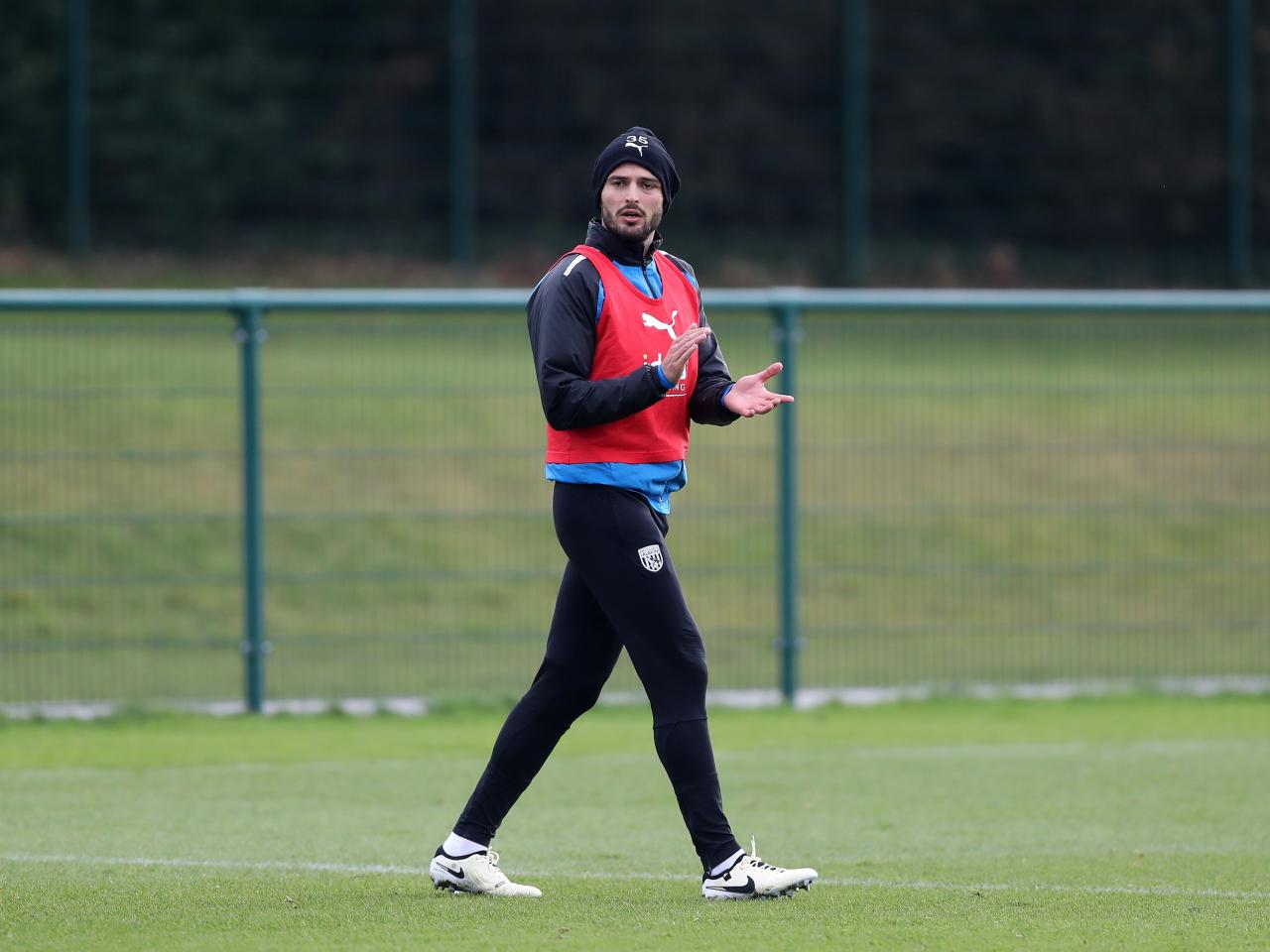 Okay Yokuslu in a red bib in training 