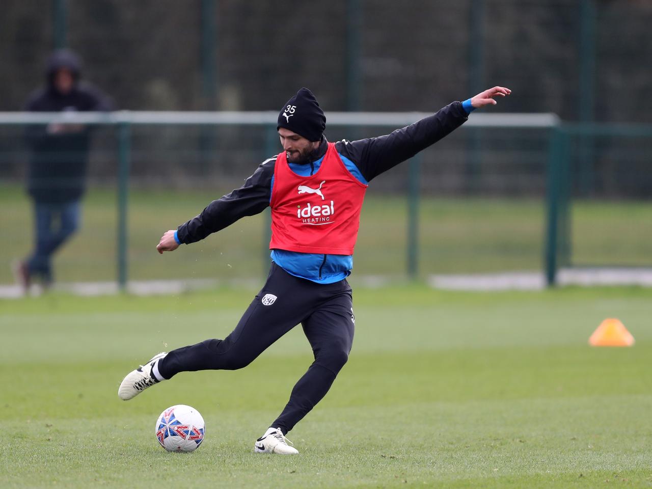 Okay Yokuslu strikes a ball in training 