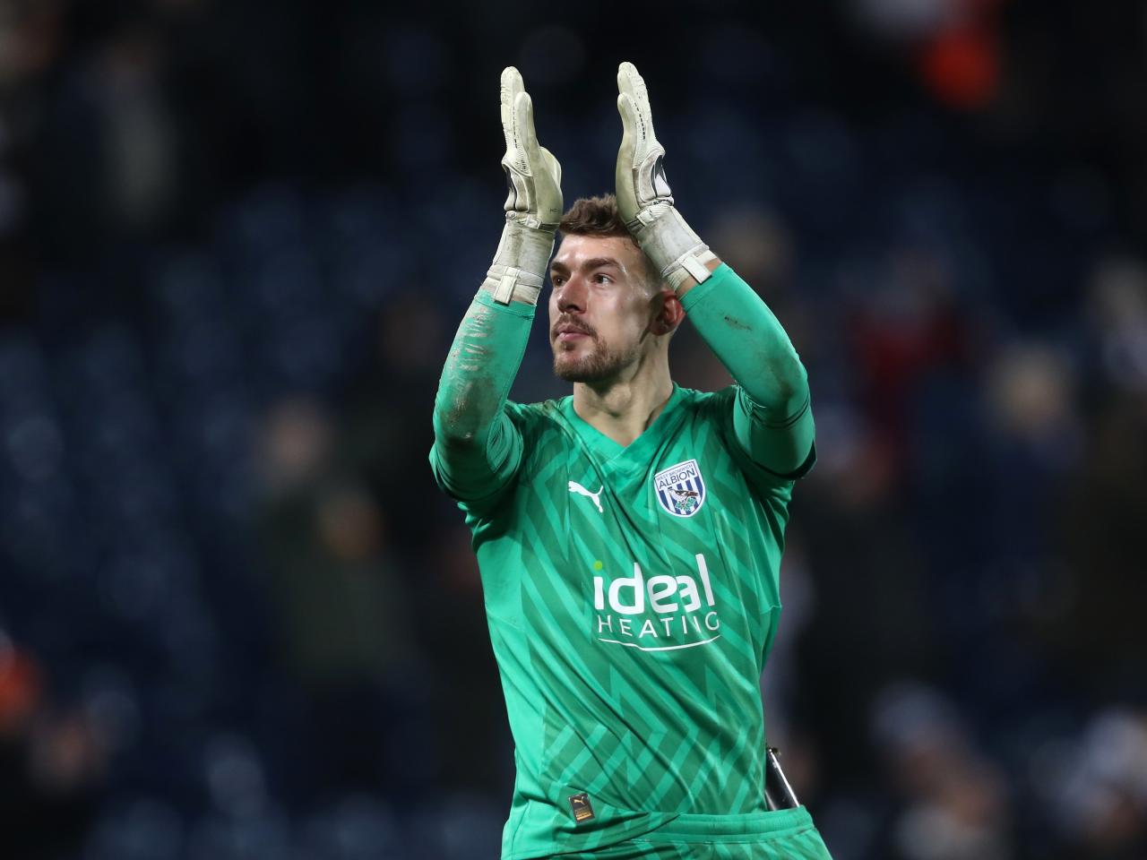 Alex Palmer applauds supporters after full time against Blackburn