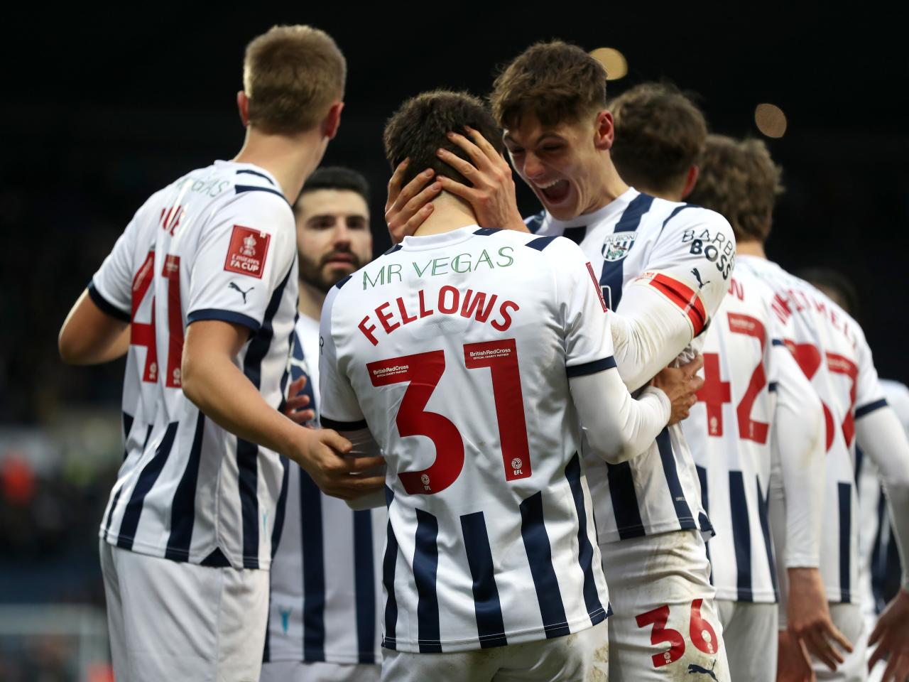 Tom Fellows celebrates scoring against Aldershot with team-mates
