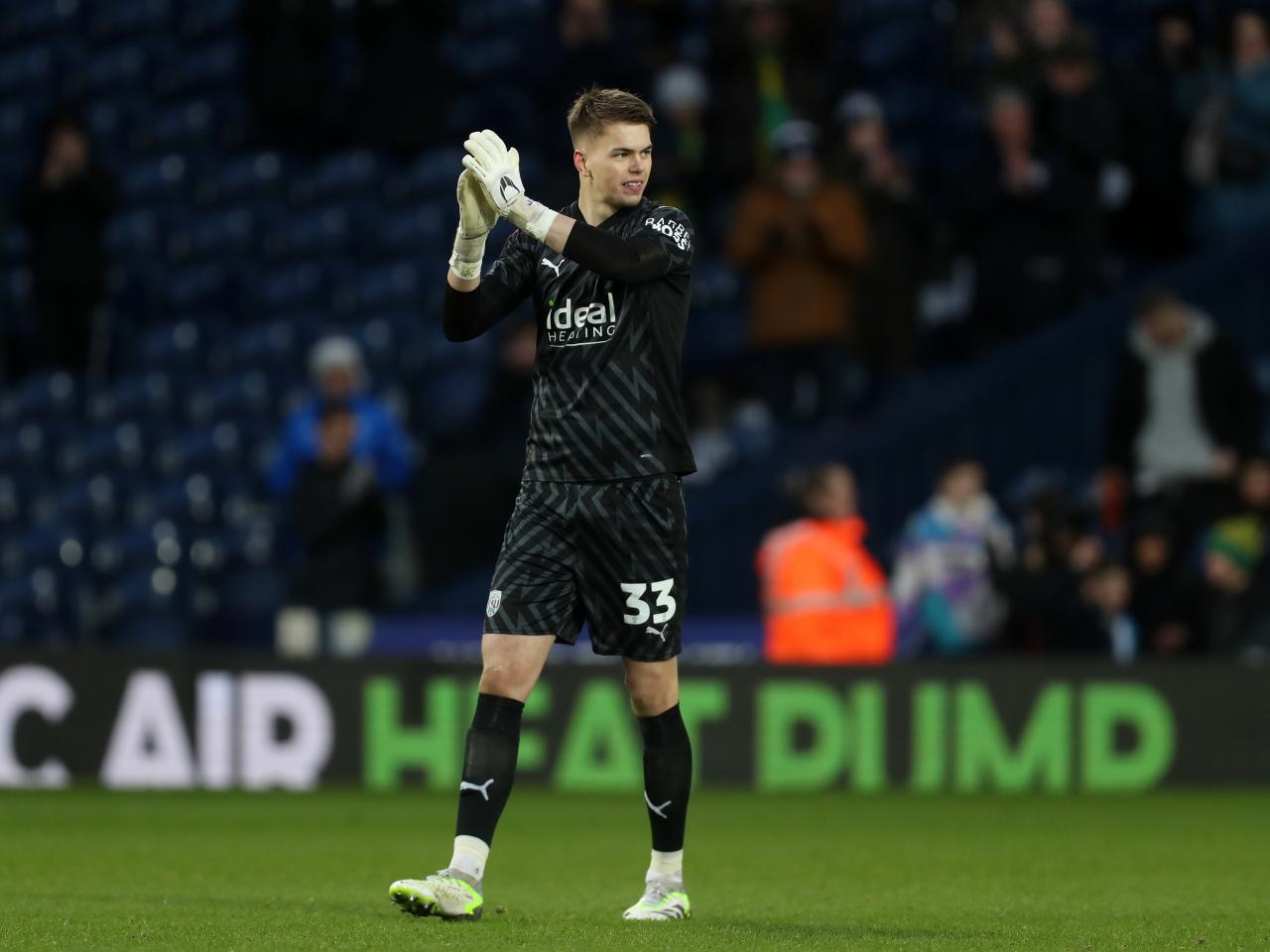 Josh Griffiths applauds supporters after the Aldershot game