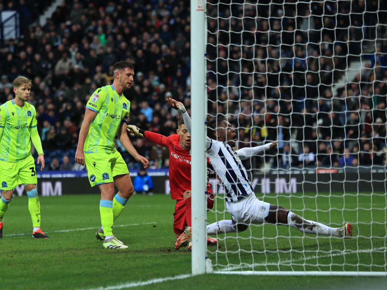 Brandon Thomas-Asante stretches for the ball on the goaline 