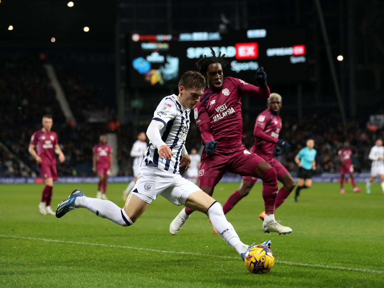 Tom Fellows taking on a Cardiff defender