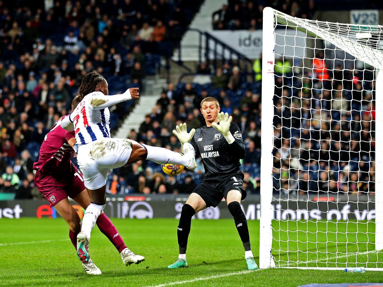 Brandon Thomas-Asante stretches to keep the ball alive for Albion