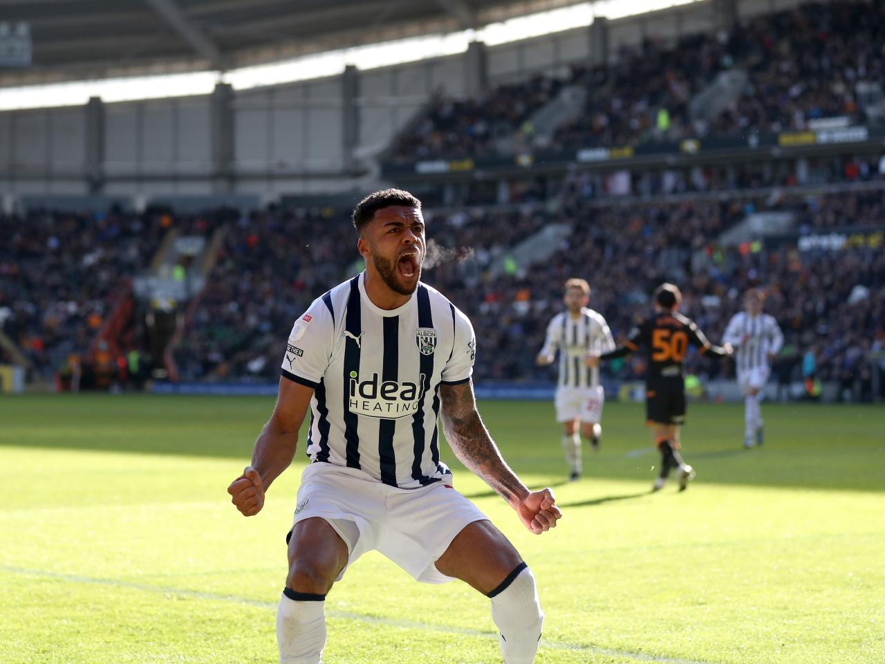 Darnell Furlong celebrates his goal against Hull in front of the Albion fans