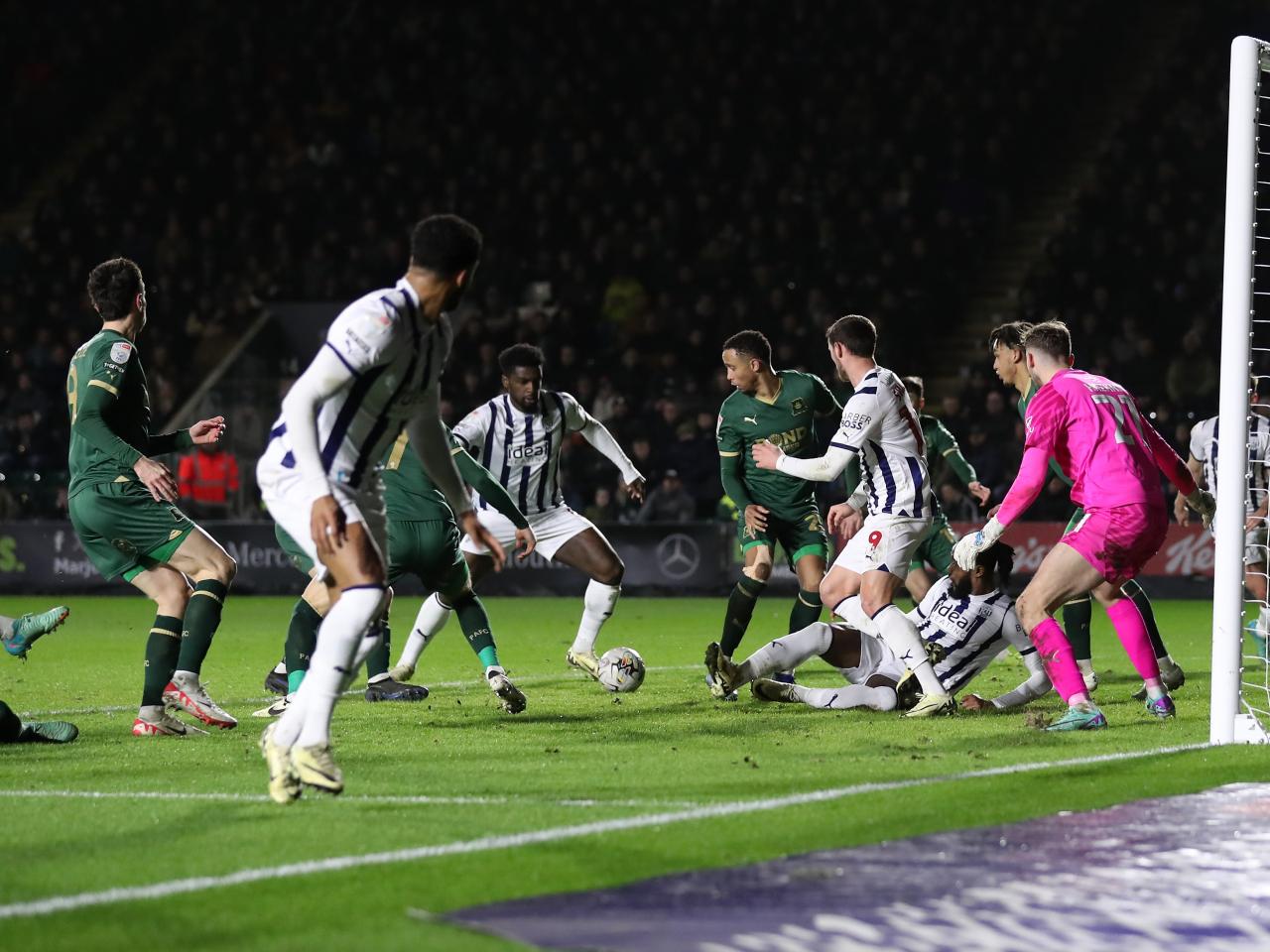 Cedric Kipre prepares to smash the ball into the net against Plymouth Argyle