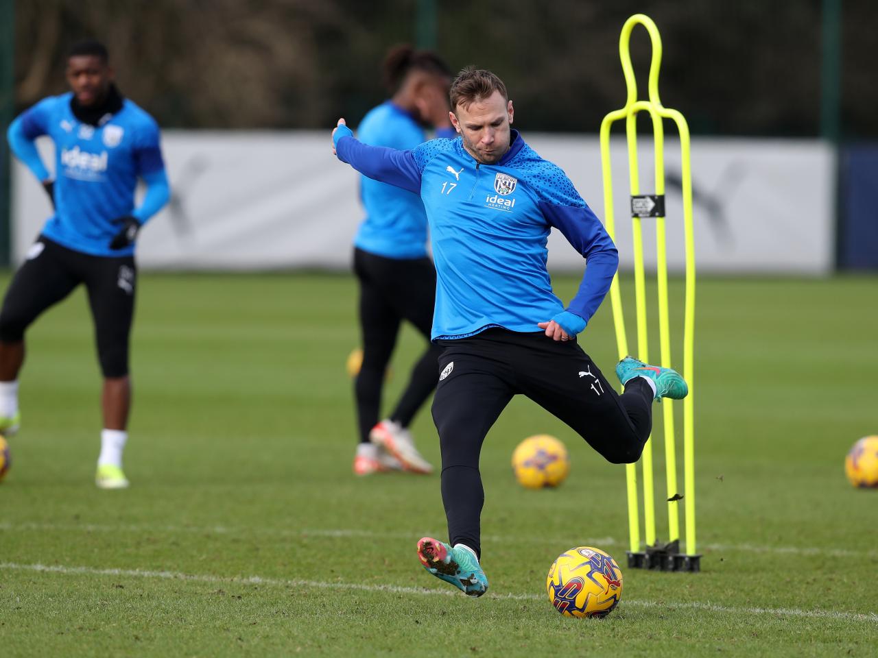 Andi Weimann striking a ball during a training session