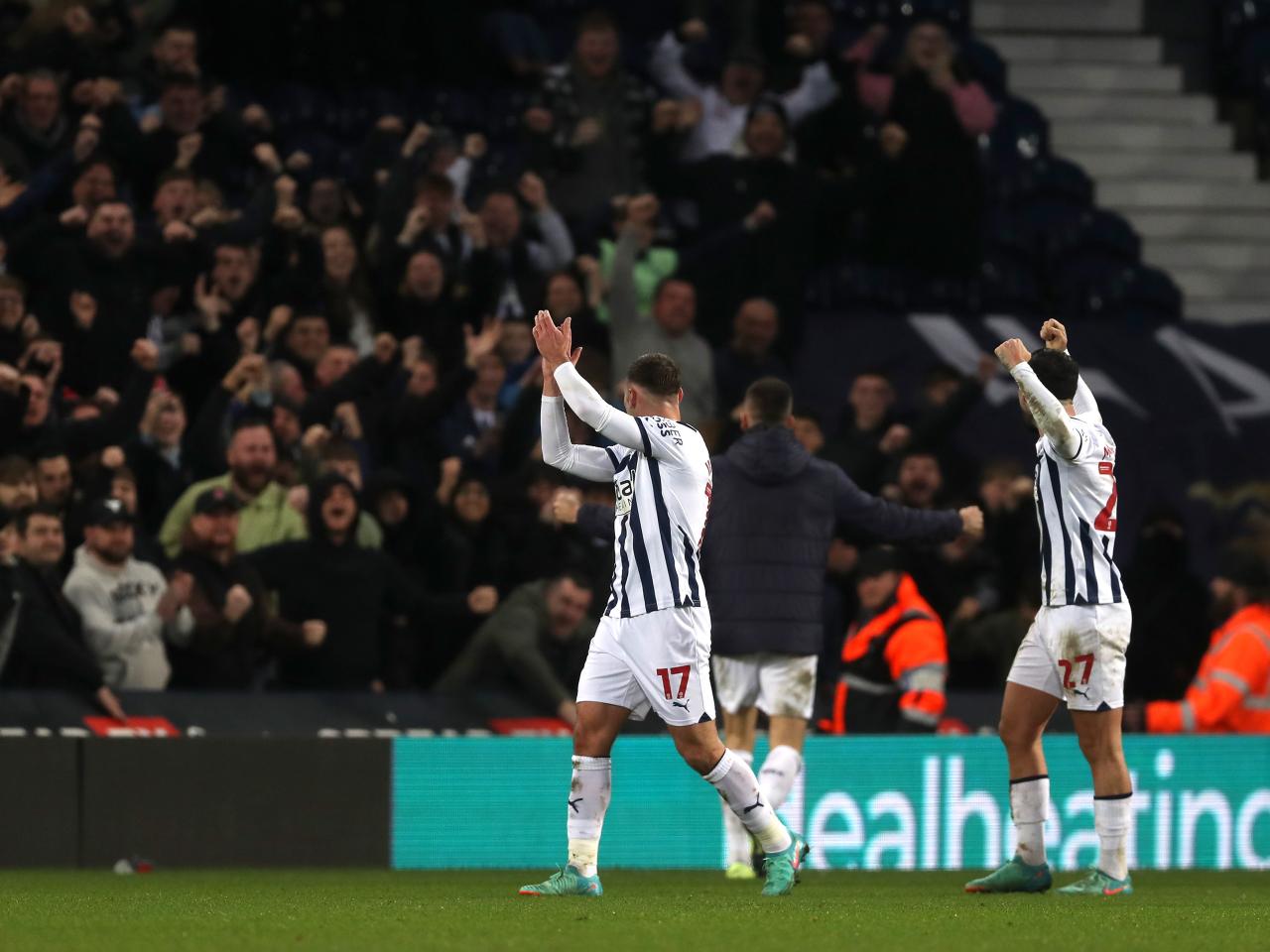 Andi Weimann and Alex Mowatt celebrate the win over Blues with supporters