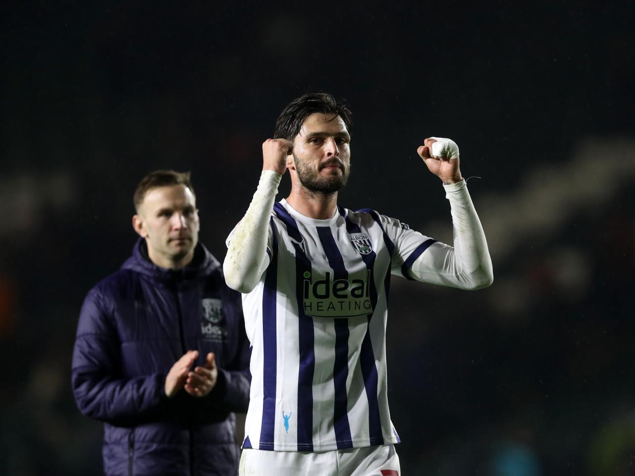 Okay Yokuslu applauds Albion fans after the full-time whistle at Plymouth