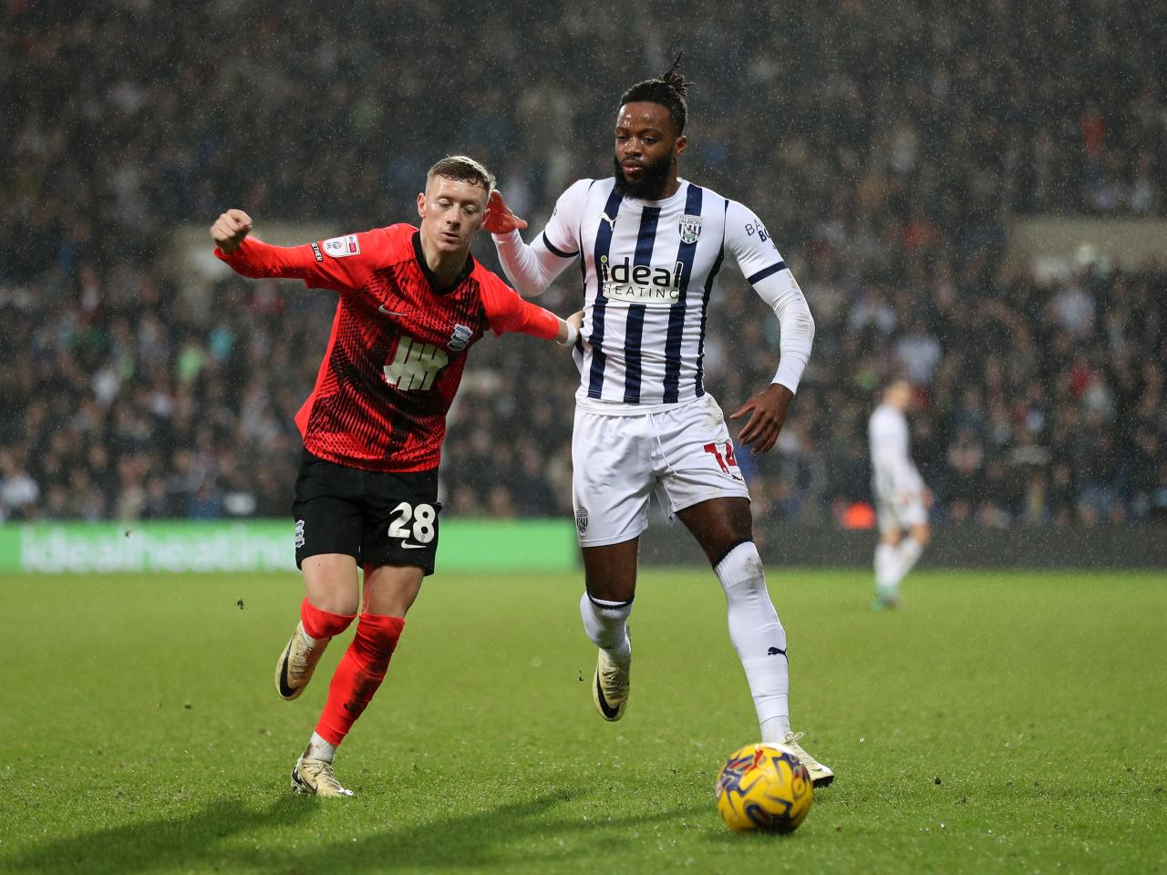 Nathanial Chalobah fights for the ball against Blues