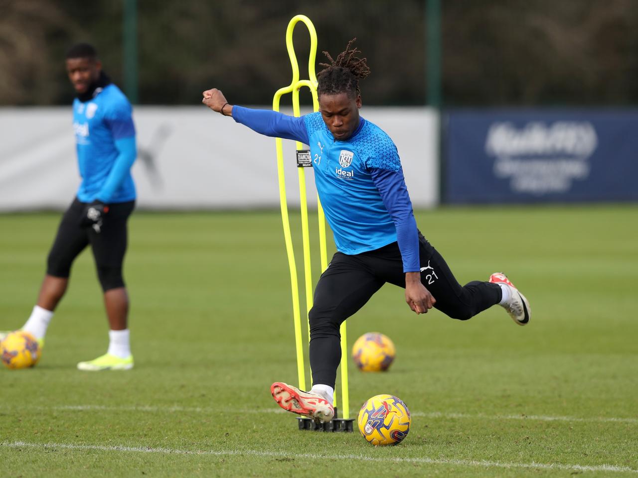 Brandon Thomas-Asante striking the ball in training 