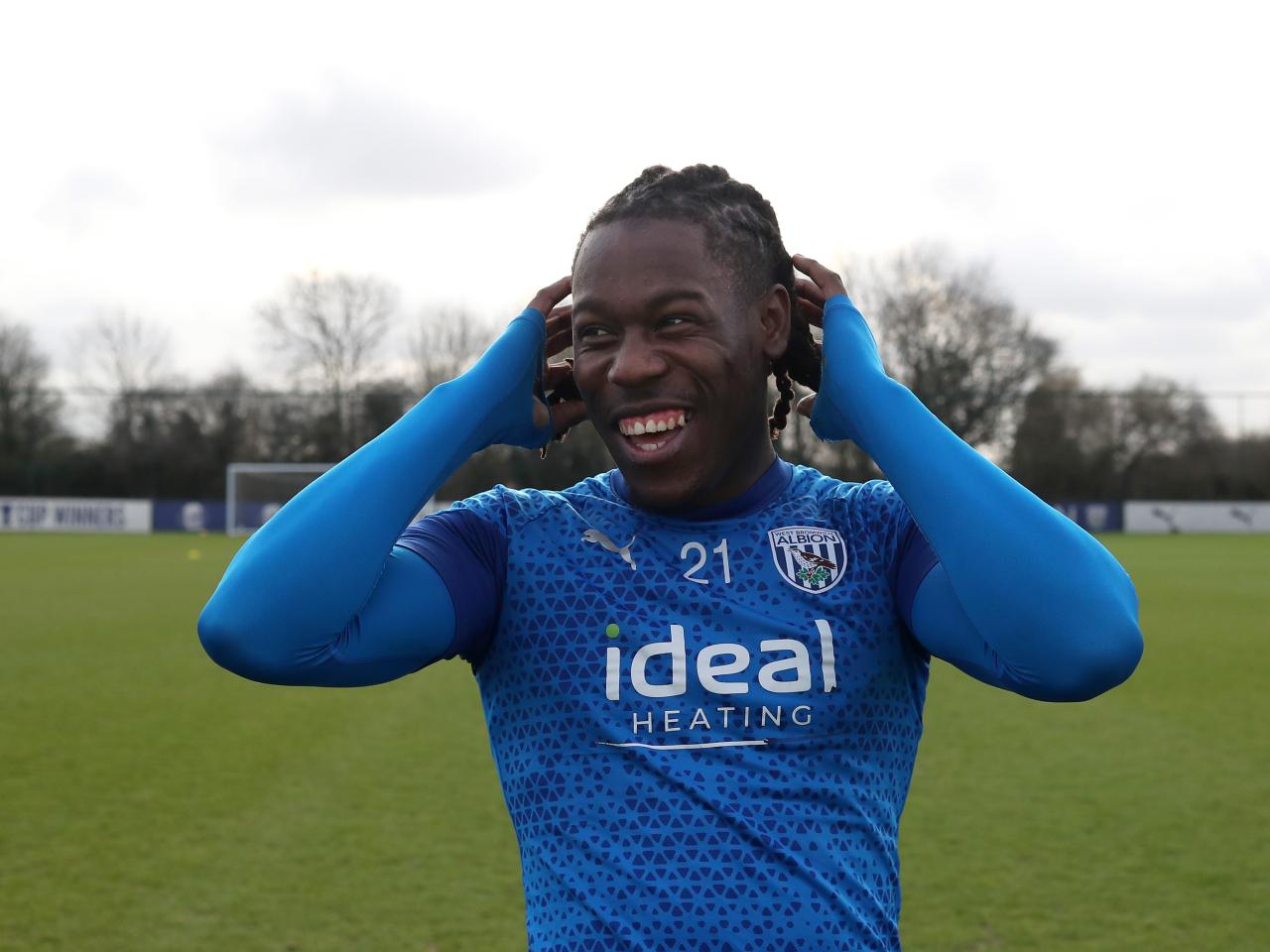 Brandon Thomas-Asante smiling during a training session