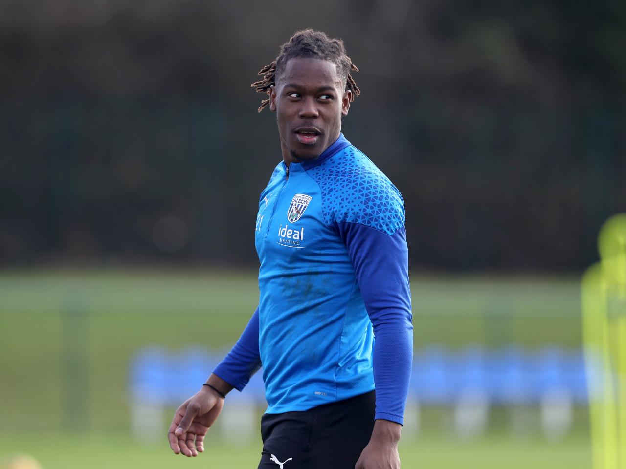 Brandon Thomas-Asante smiling in training 