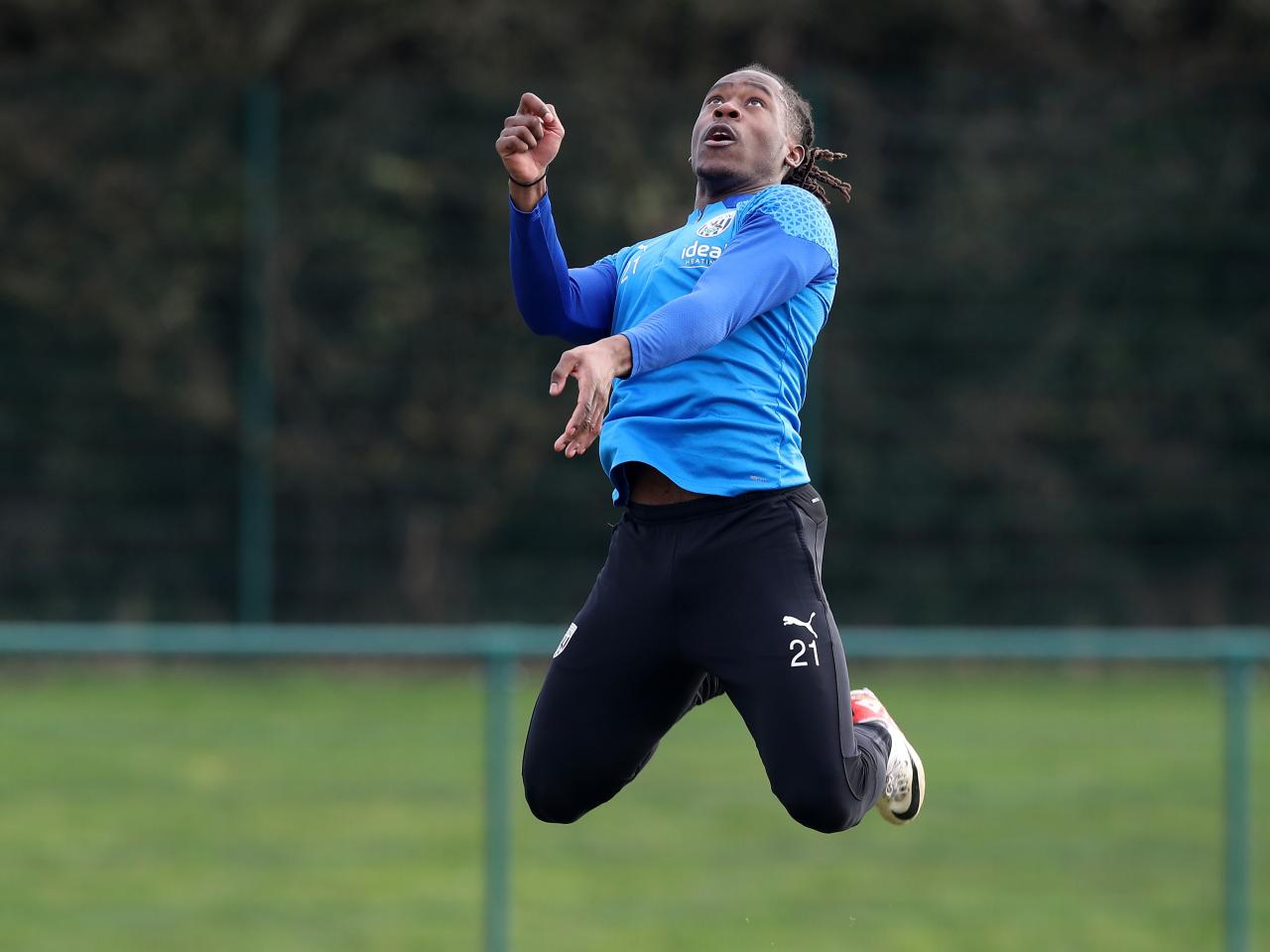 Brandon Thomas-Asante leaping in the air in training 