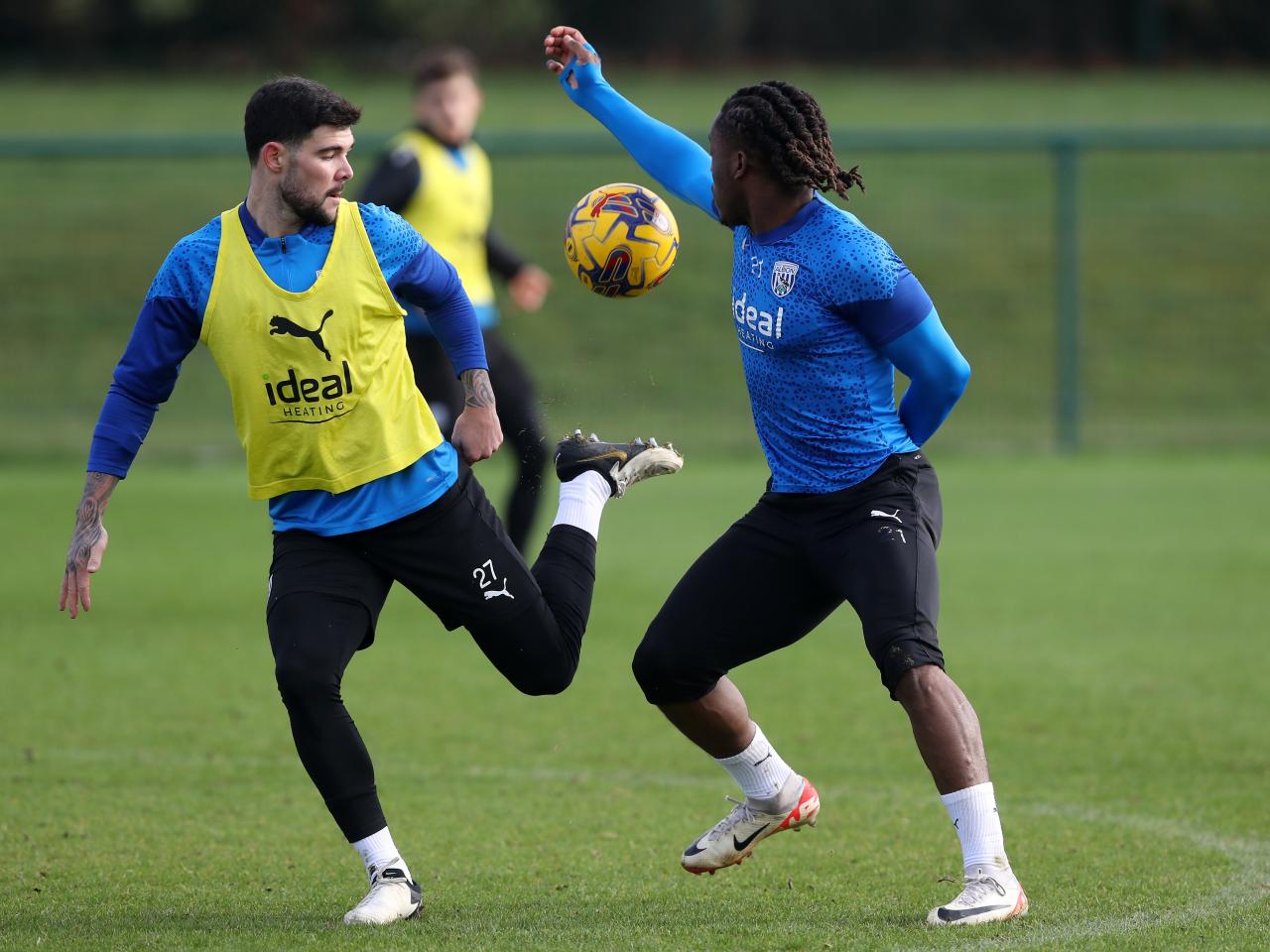 Brandon Thomas-Asante and Alex Mowatt battle for the ball during training