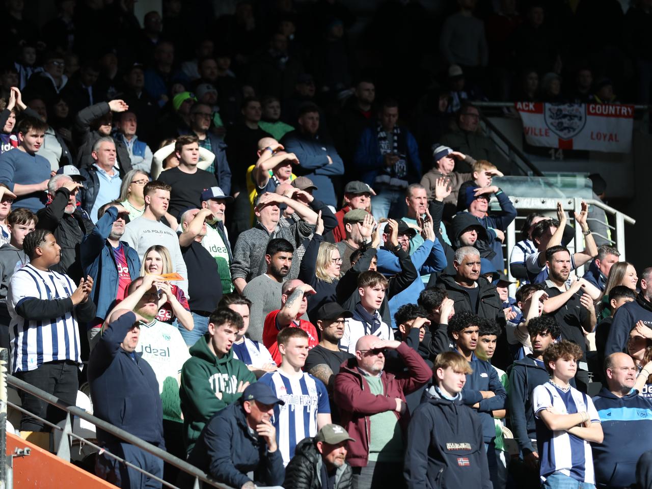 A general view of Albion fans in the away end at the MKM Stadium
