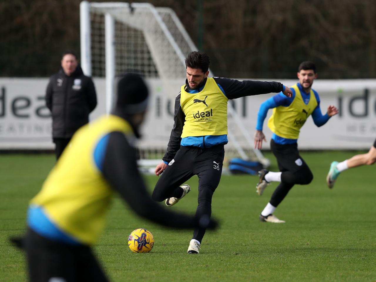Okay Yokuslu passes the ball during training 