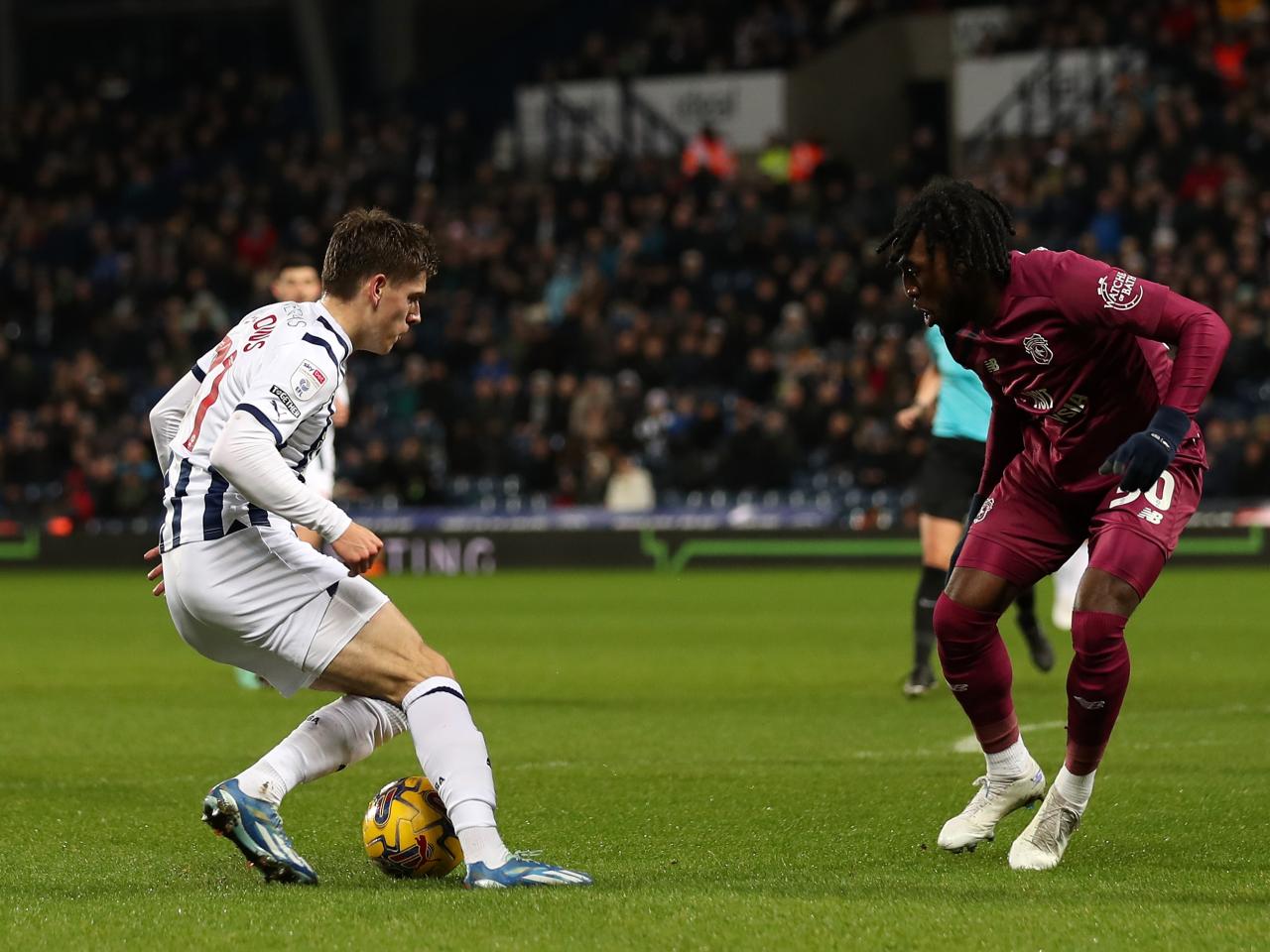 Tom Fellows taking on a Cardiff defender