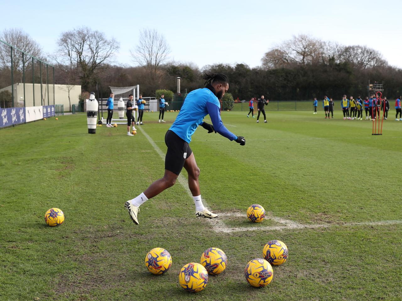 Nathanial Chalobah taking a series of corner kicks in training 