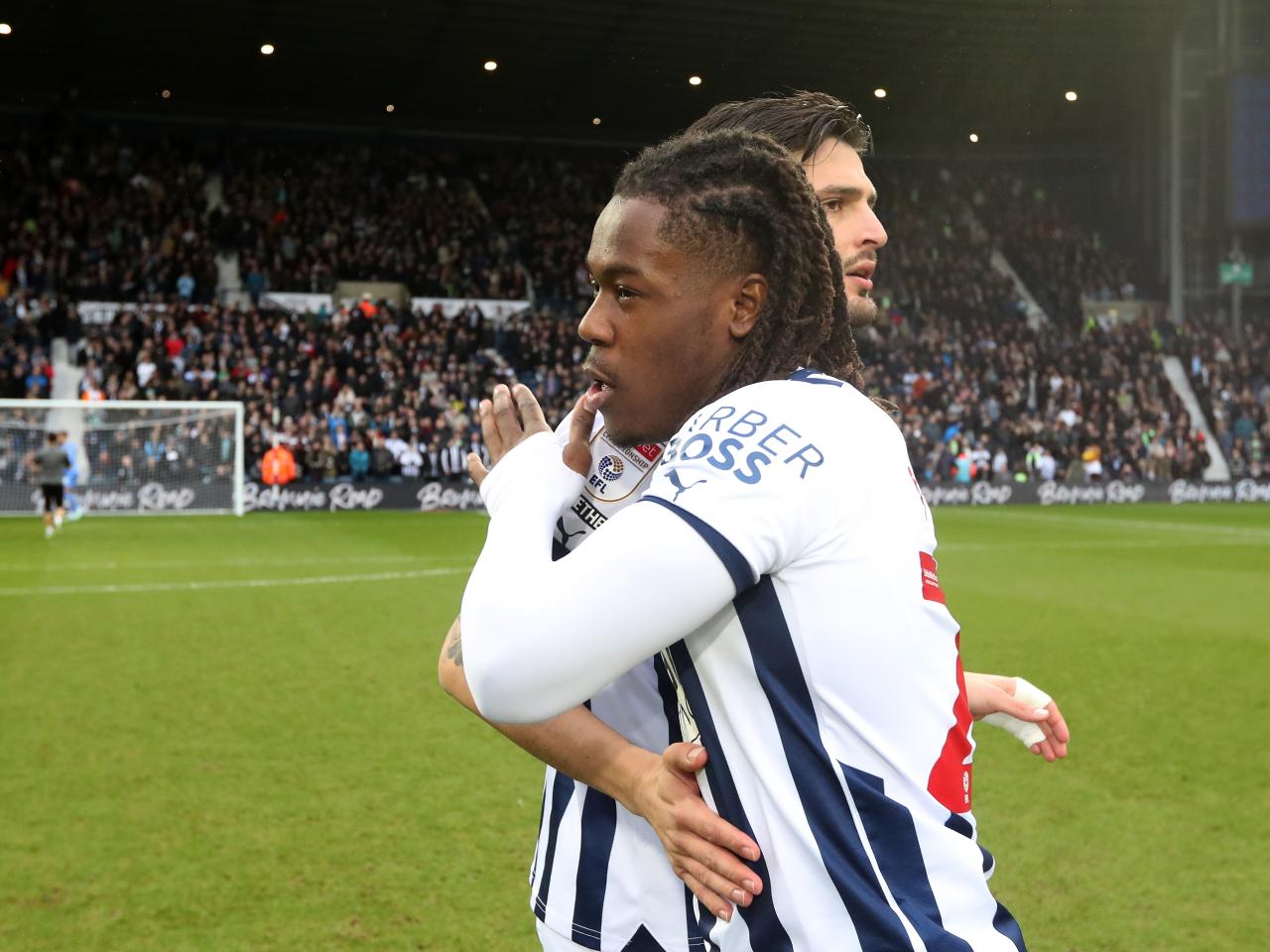 Brandon Thomas-Asante and Okay Yokuslu embrace before the game against Birmingham City