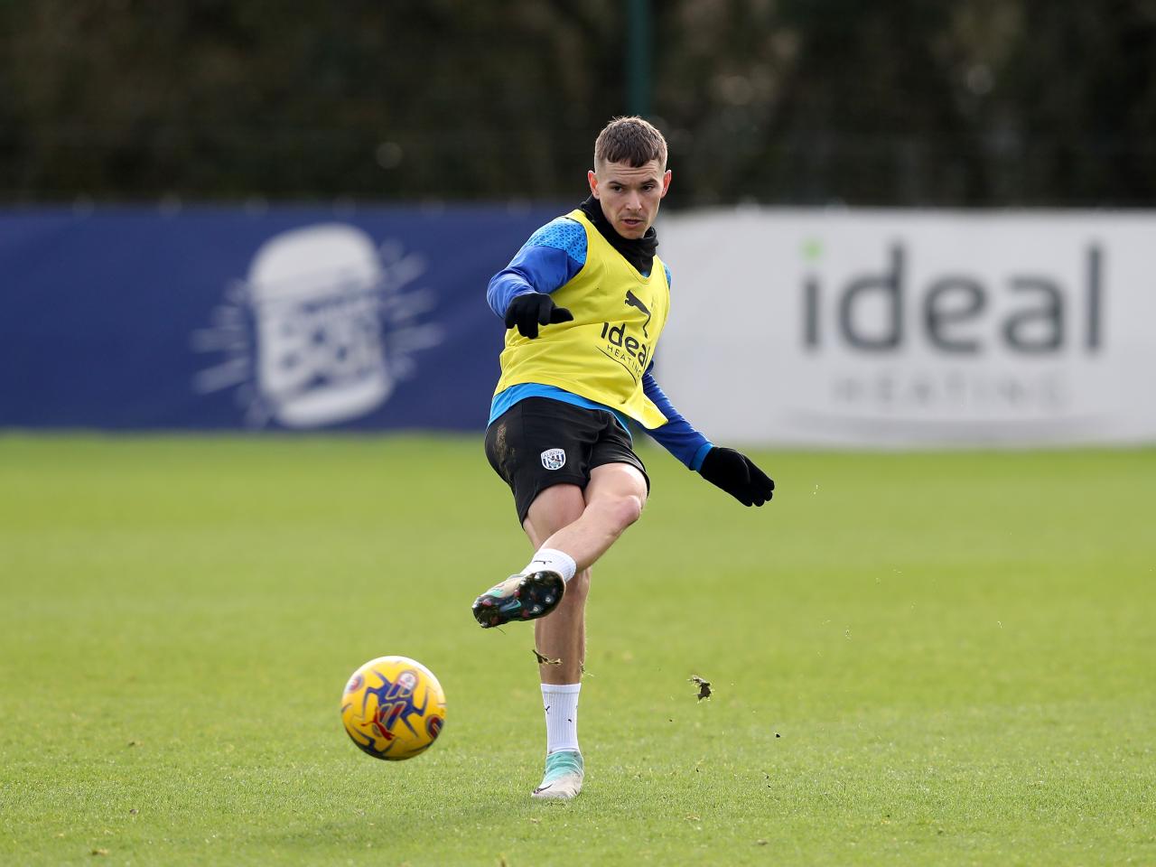 Conor Townsend passes the ball during training