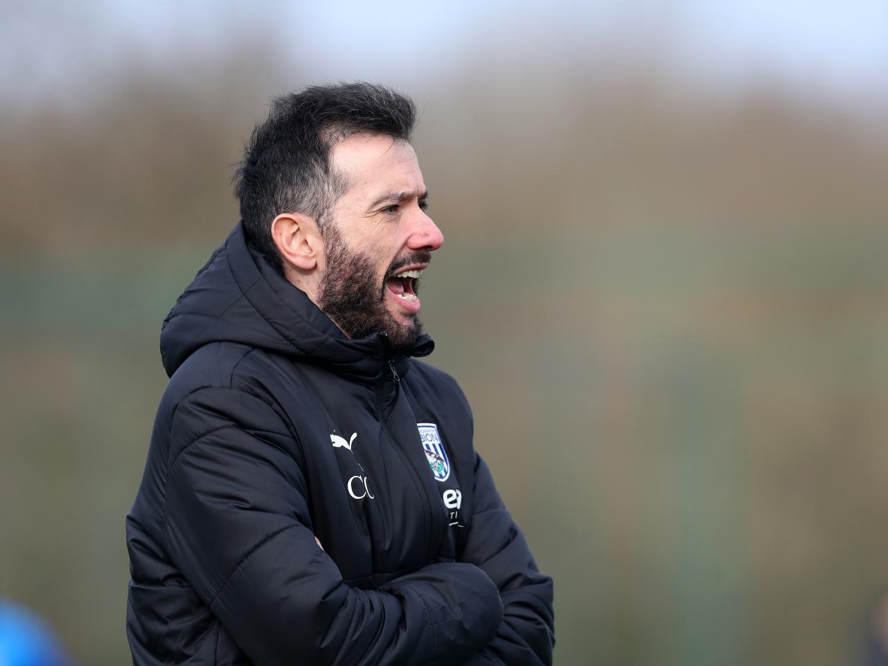 Carlos Corberán on the training pitch in the middle of a session