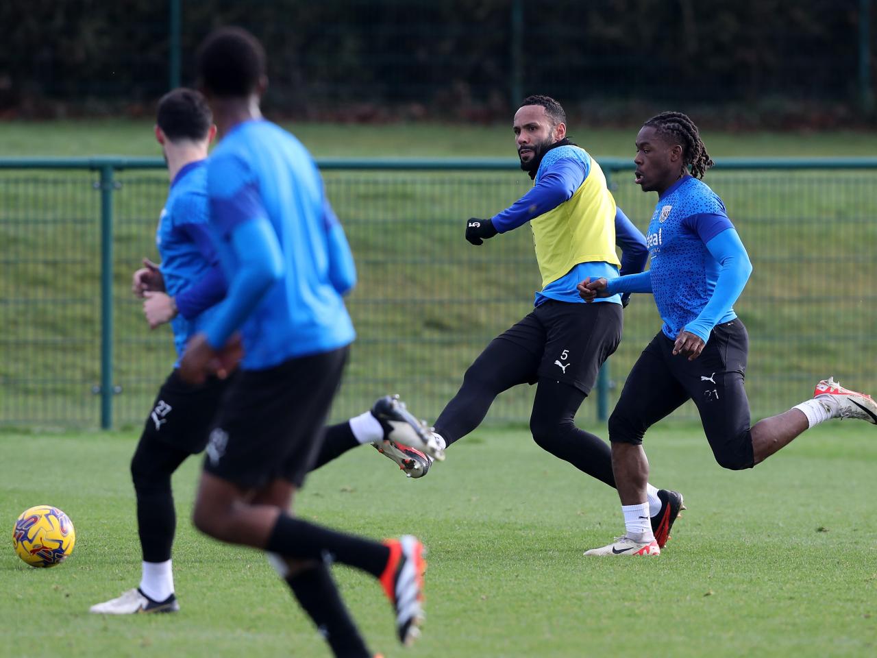 Kyle Bartley passes the ball during training