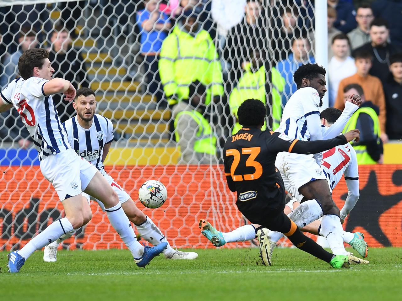 Albion players throw their bodies at the ball to try and block a Hull shot