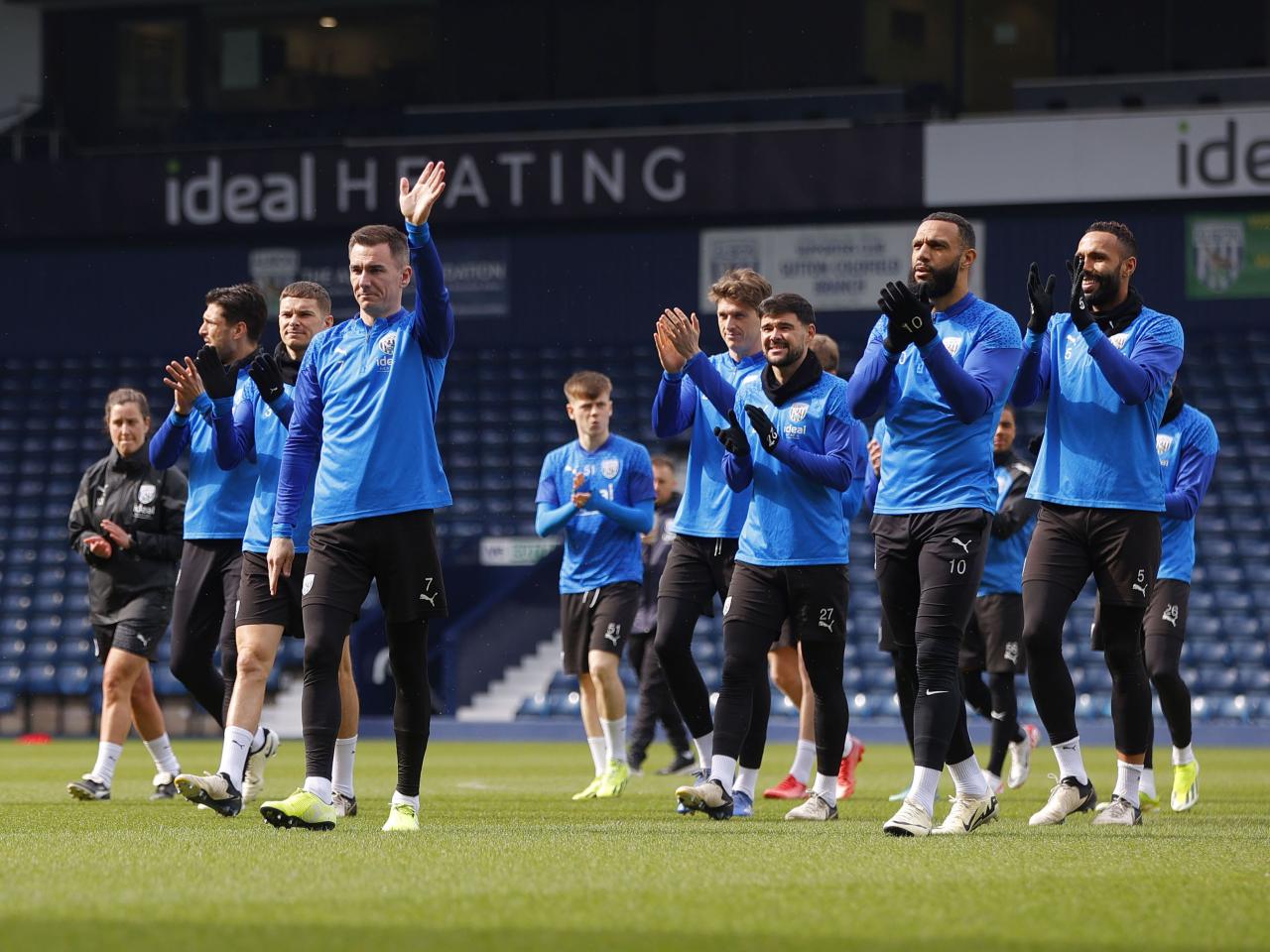 Albion players wave at and applaud supporters at The Hawthorns