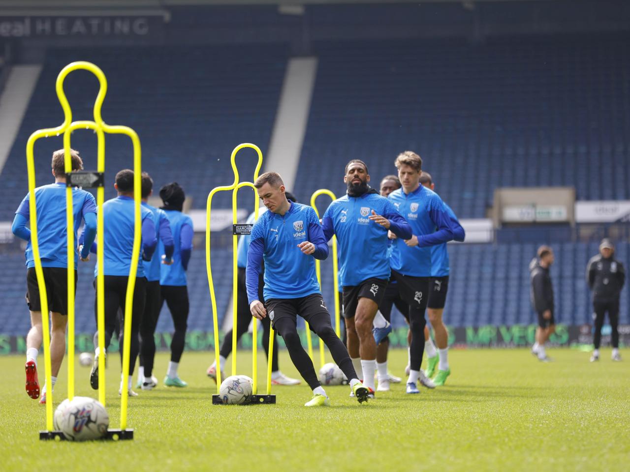 Albion players warming up on the pitch at The Hawthorns during a training session