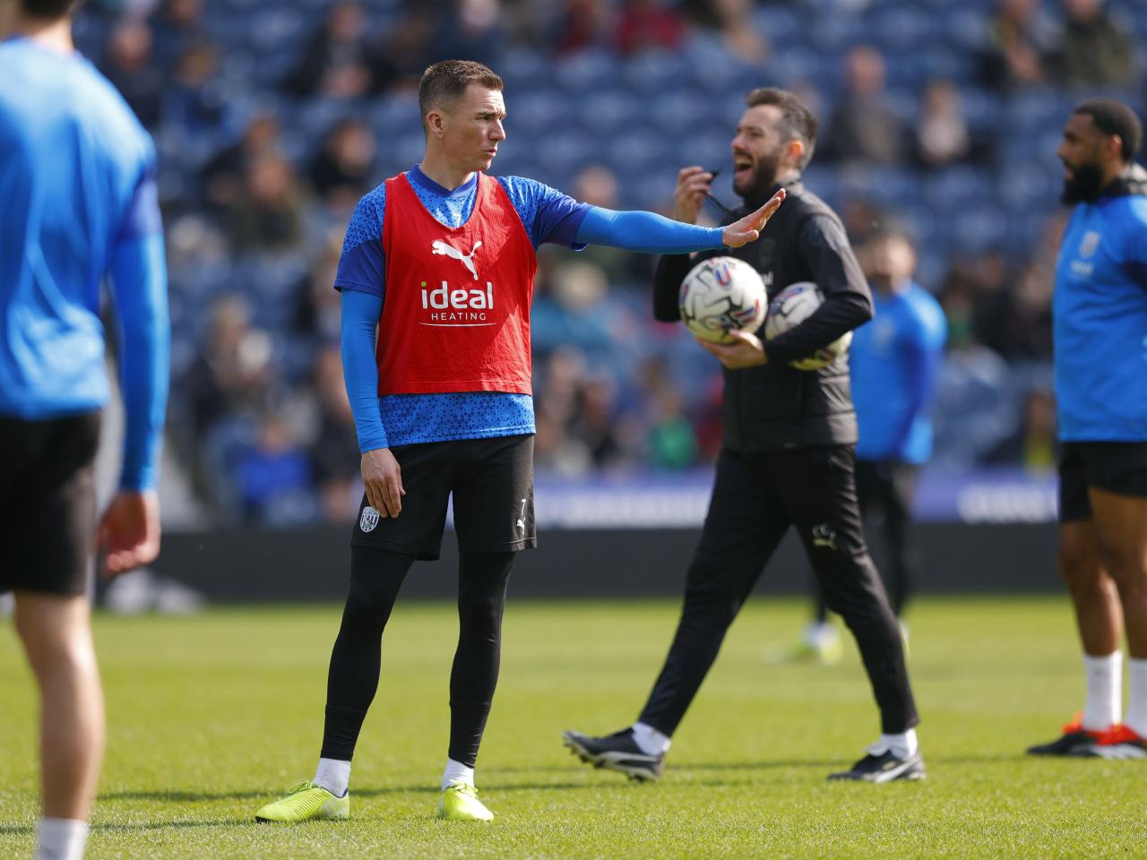Jed Wallace with his arm outstretched during a training session at The Hawthorns