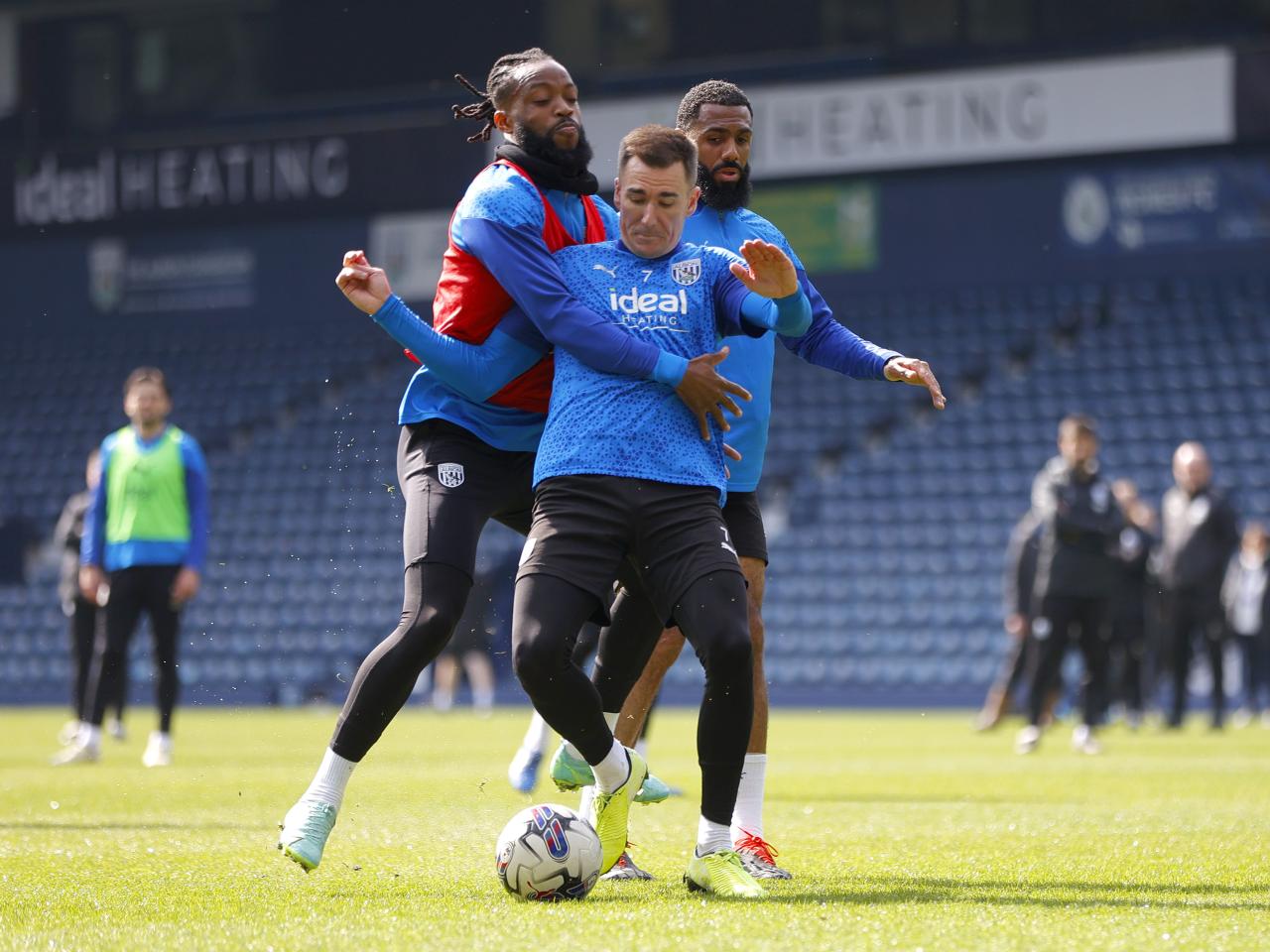 Nathaniel Chalobah and Jed Wallace fight for the ball during a training session at The Hawthorns