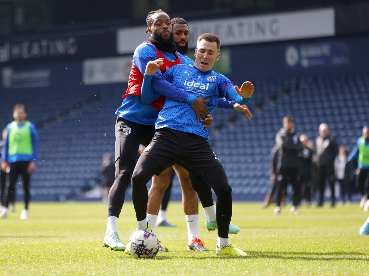 Nathaniel Chalobah and Jed Wallace fight for the ball during a training session at The Hawthorns