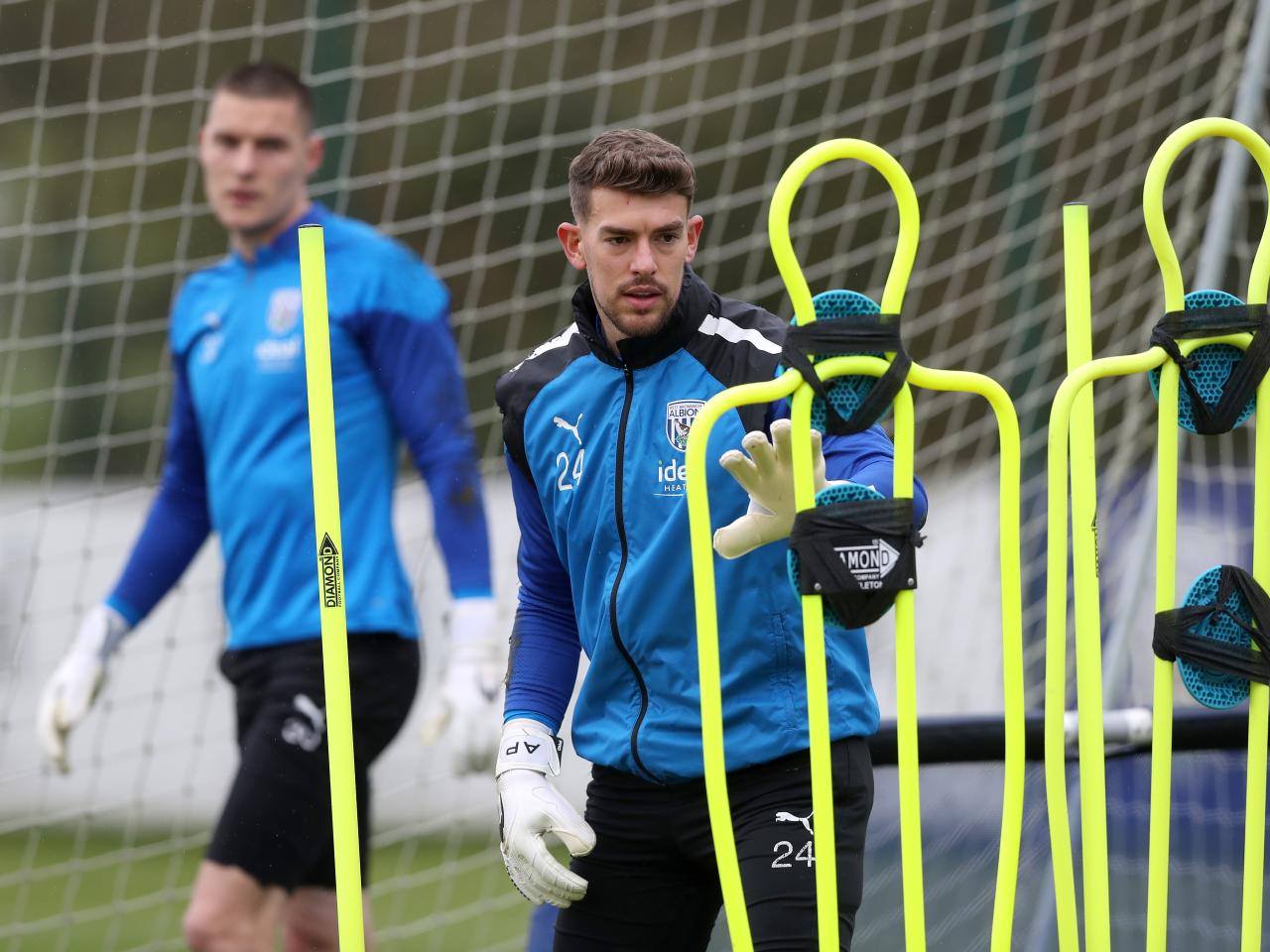Alex palmer approaches a mannequin during a training session