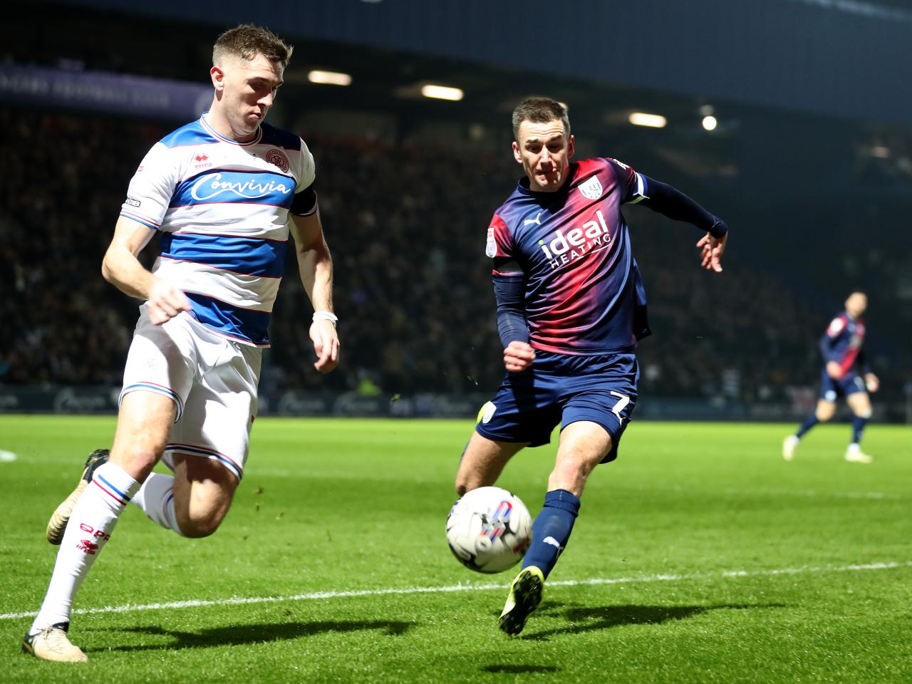 Jed Wallace chasing down the ball and a QPR player 