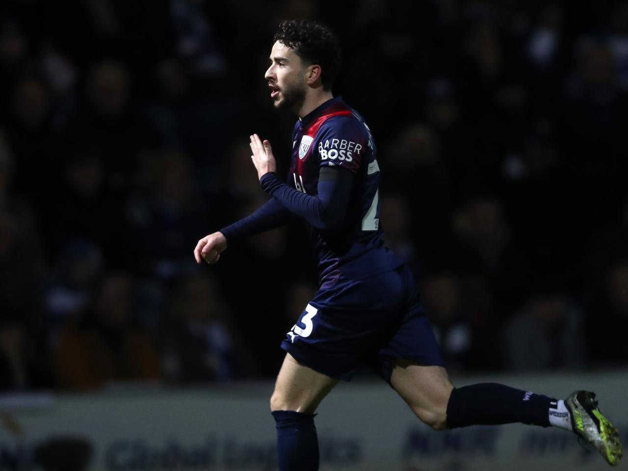 Mikey Johnston celebrates scoring a goal at QPR 