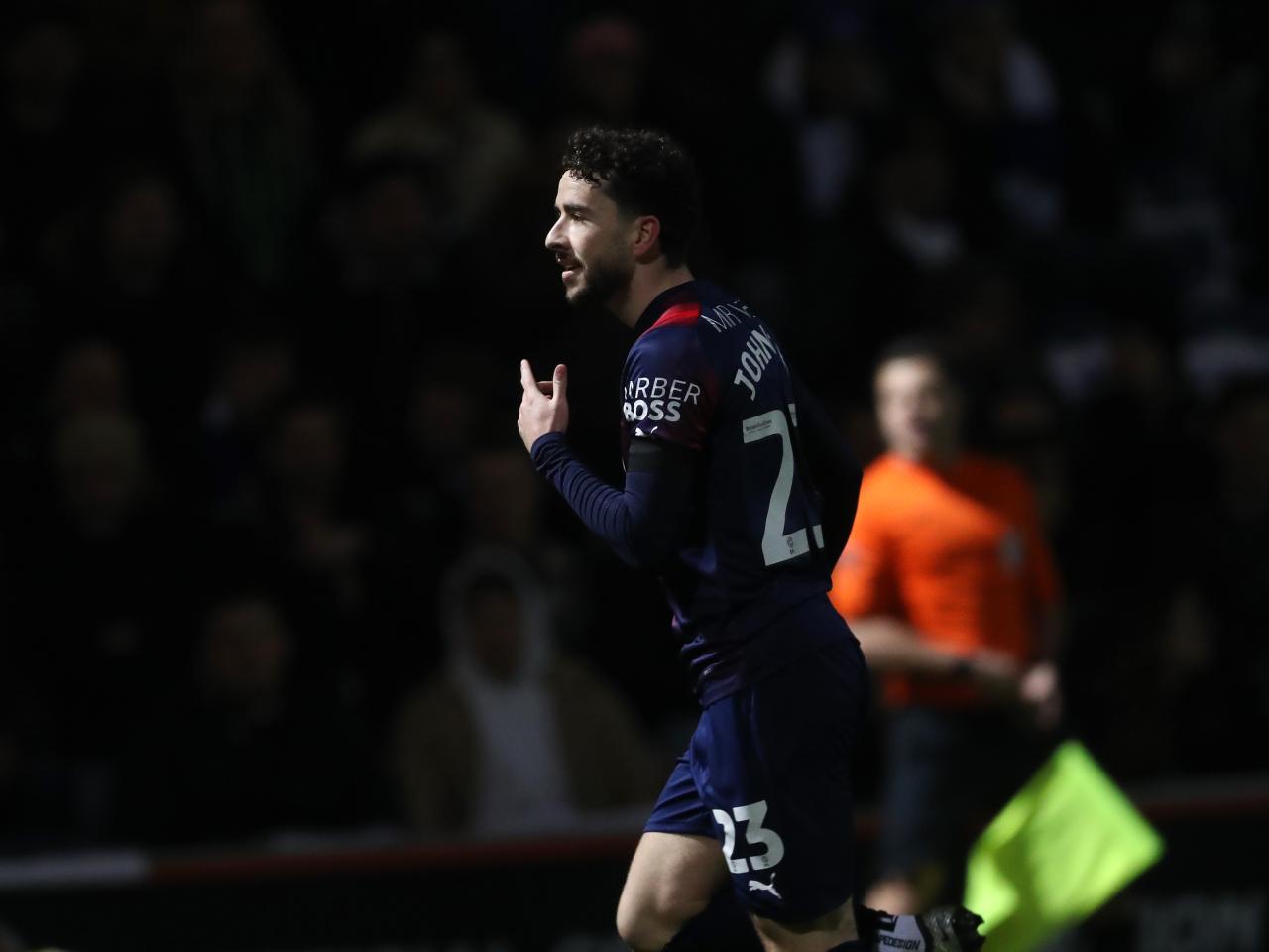 Mikey Johnston celebrates scoring a goal at QPR 