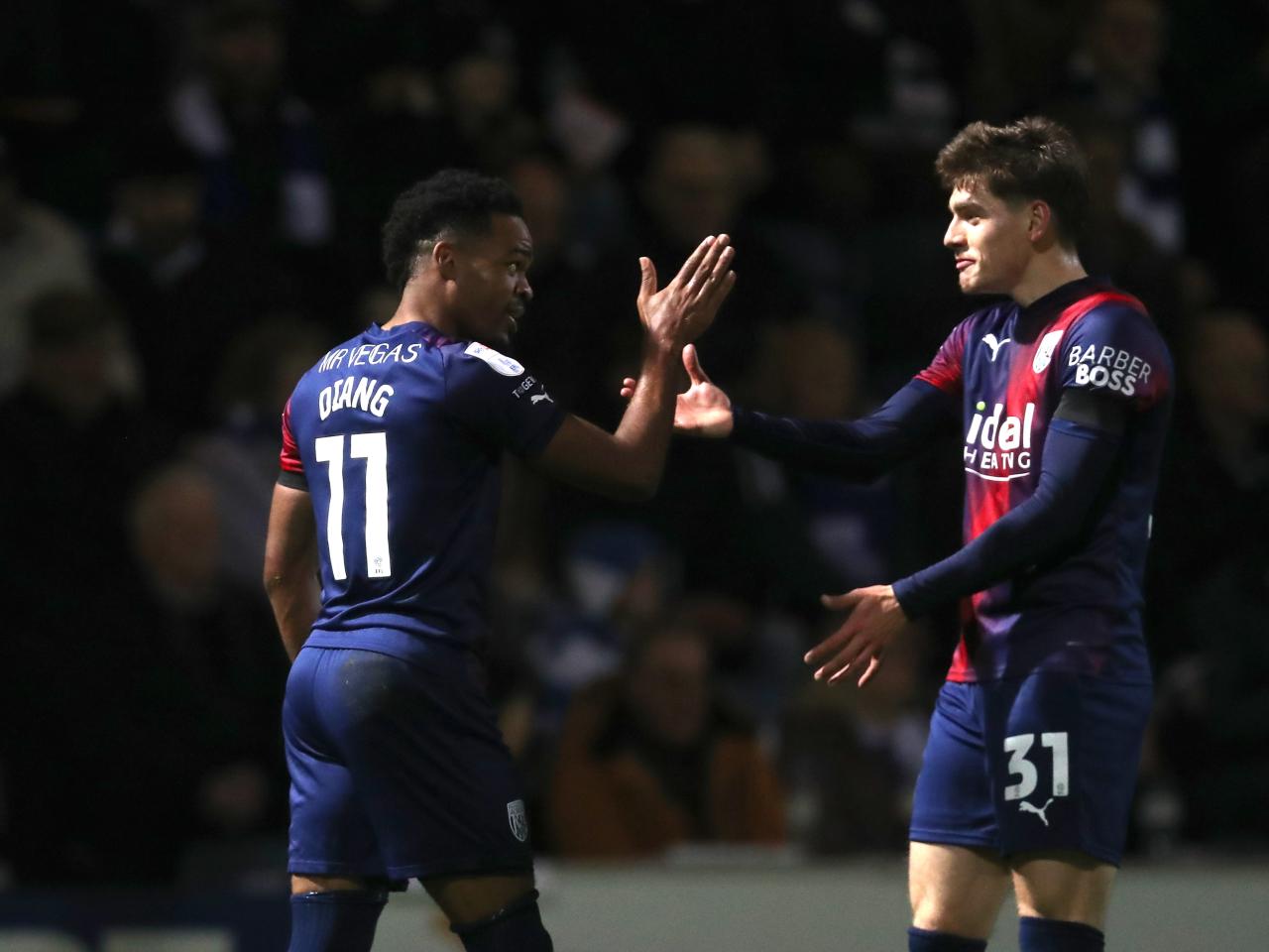Grady Diangana celebrates scoring a goal against QPR with Tom Fellows