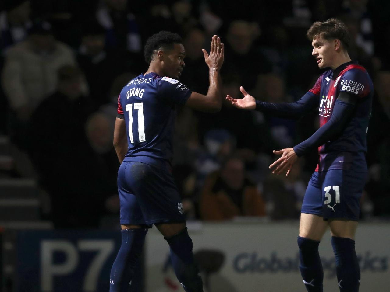 Grady Diangana celebrates scoring a goal against QPR with Tom Fellows