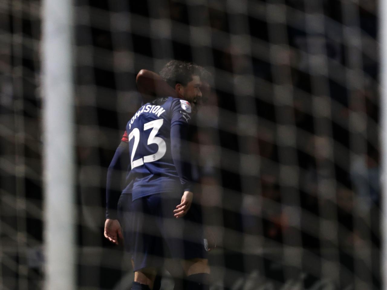 Mikey Johnston celebrates scoring a goal at QPR with Grady Diangana