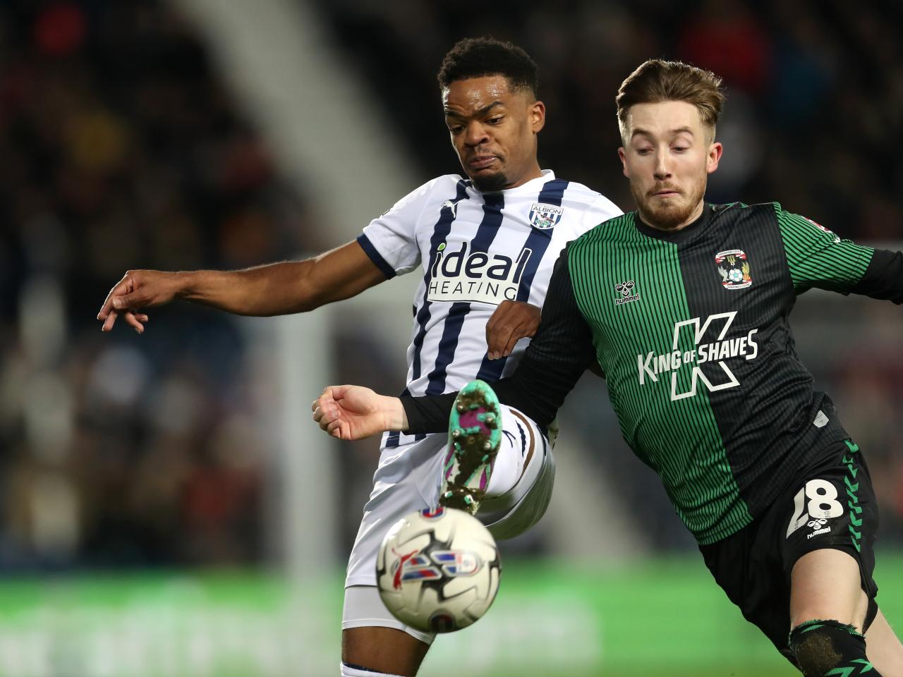 Grady Diangana fights for the ball against a Coventry player