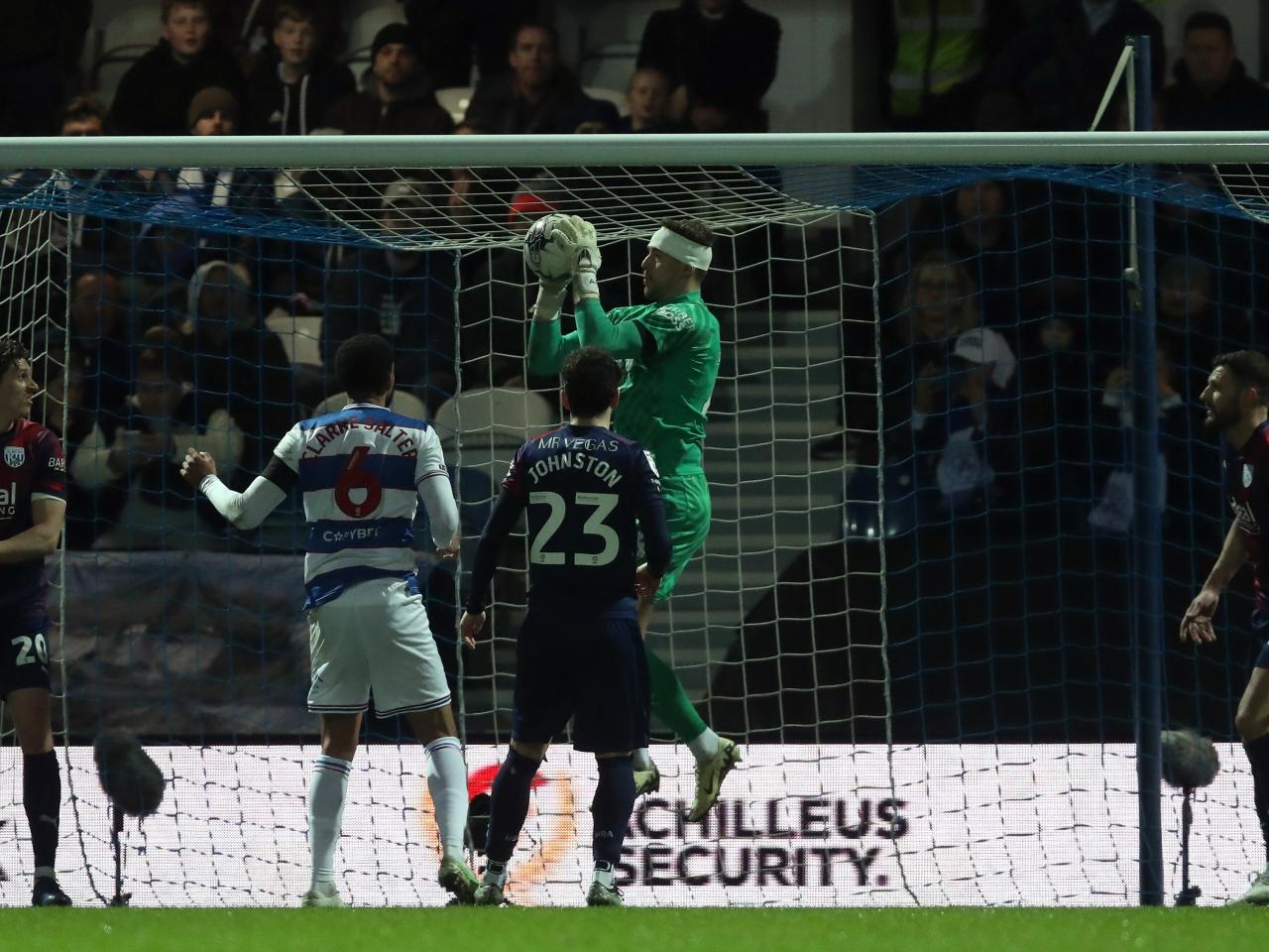 Alex Palmer catching the ball from a QPR cross