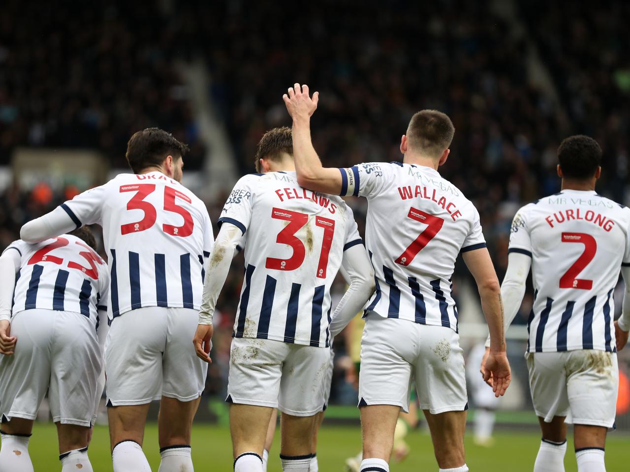 Tom Fellows celebrates scoring against Bristol City with several team-mates