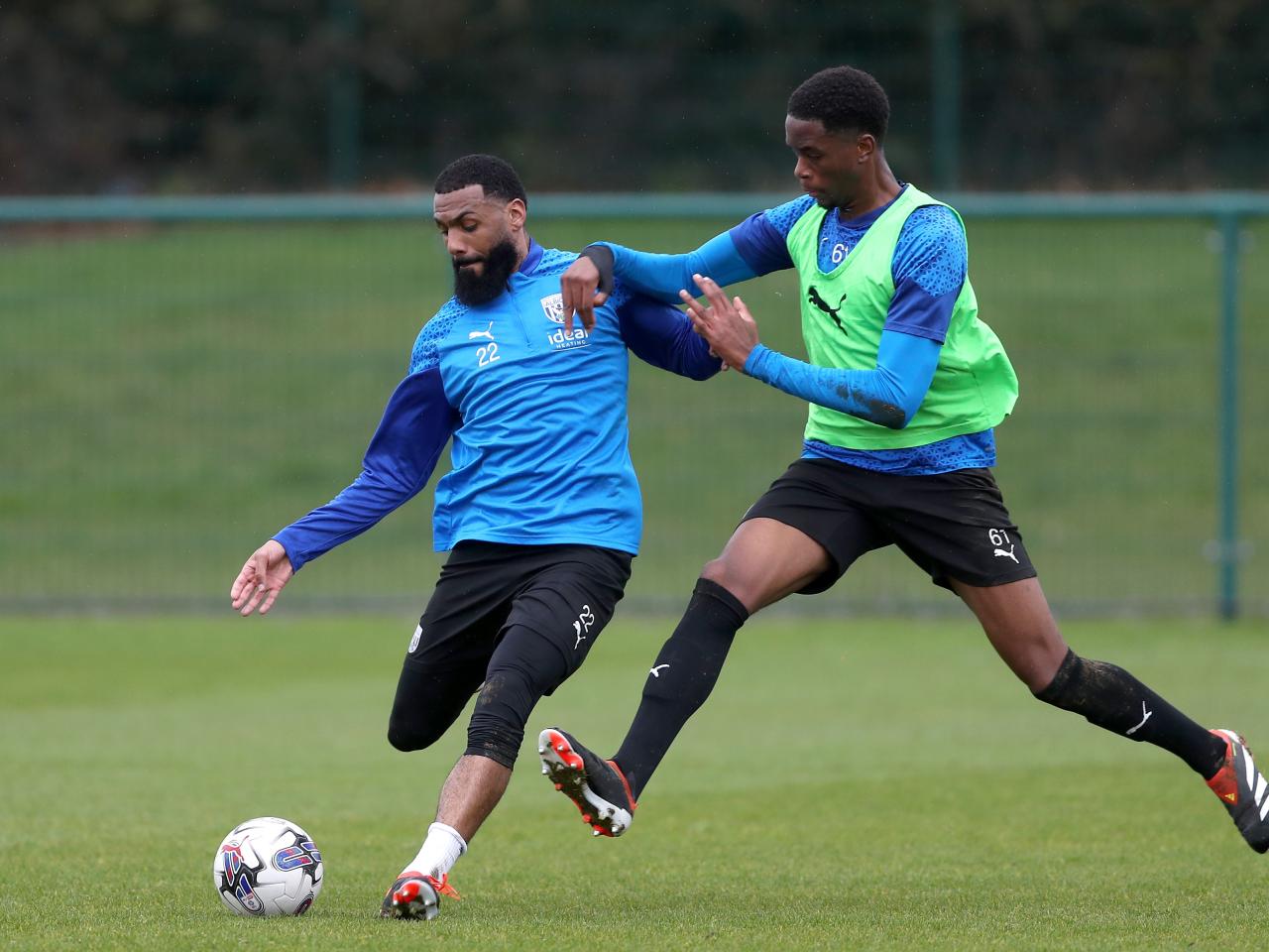 Yann M'Vila playing a pass during a training session