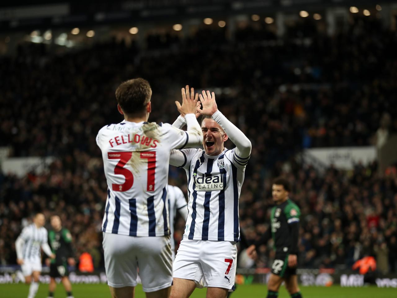 Tom Fellows and Jed Wallace high five after Grady Diangana's goal against Coventry 