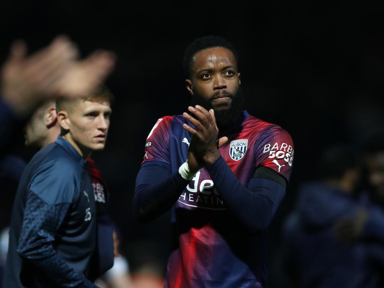 Nathaniel Chalobah applauds Albion fans after the full-time whistle at QPR 