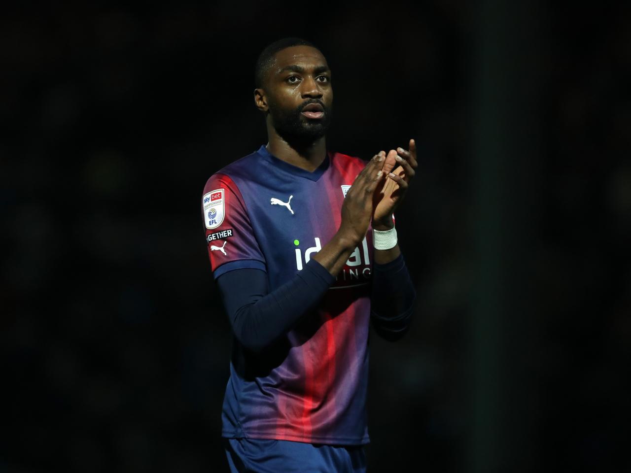 Semi Ajayi applauds Albion fans after the full-time whistle at QPR 