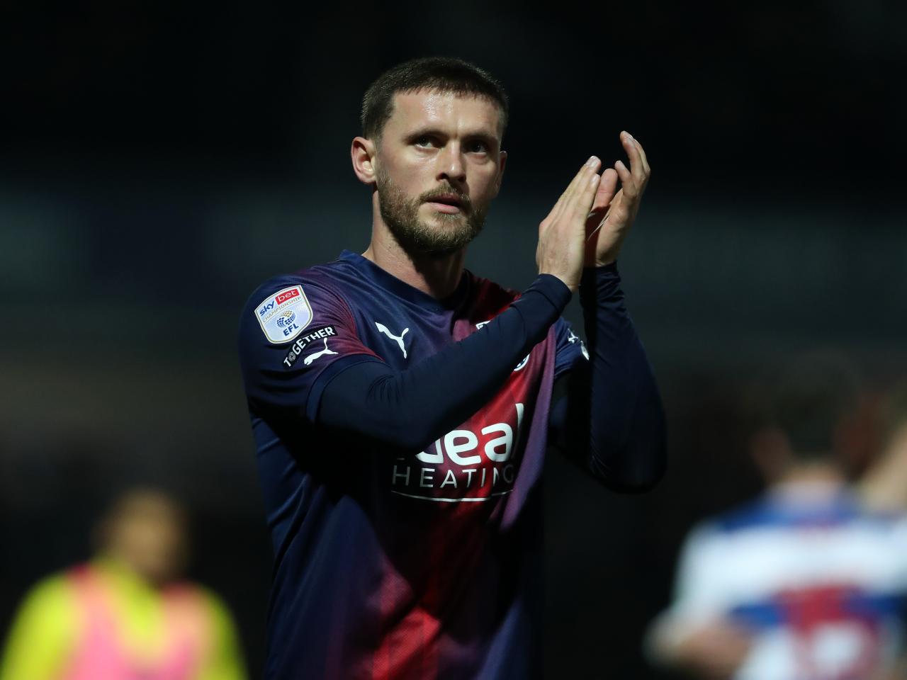 John Swift applauds Albion fans after the full-time whistle at QPR 